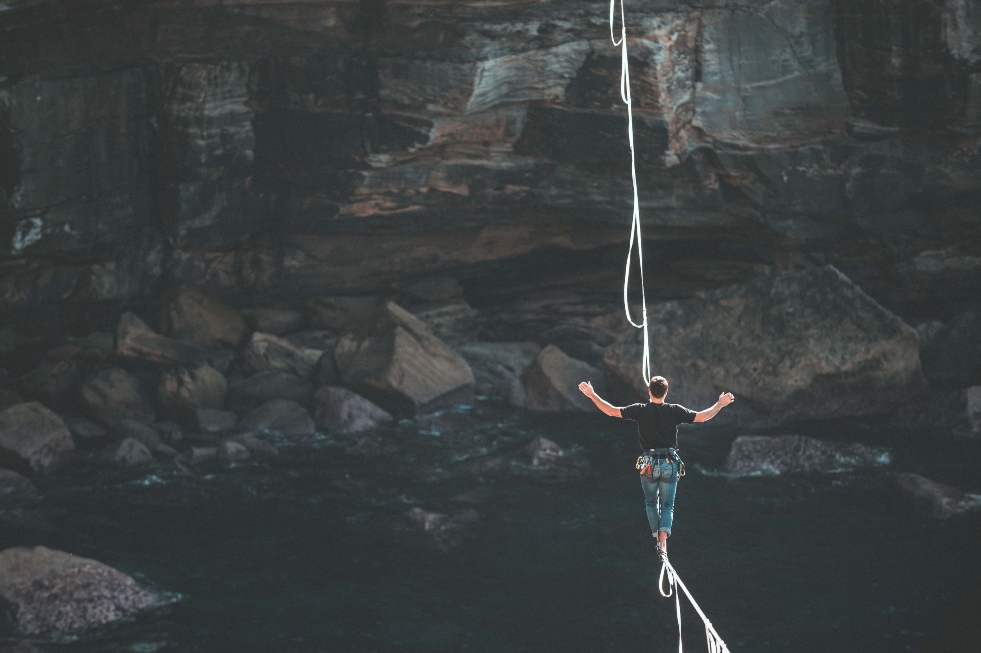 woman-walking-on-tight-rope-over-gorge