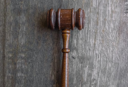 Brown mallet on gray wooden surface